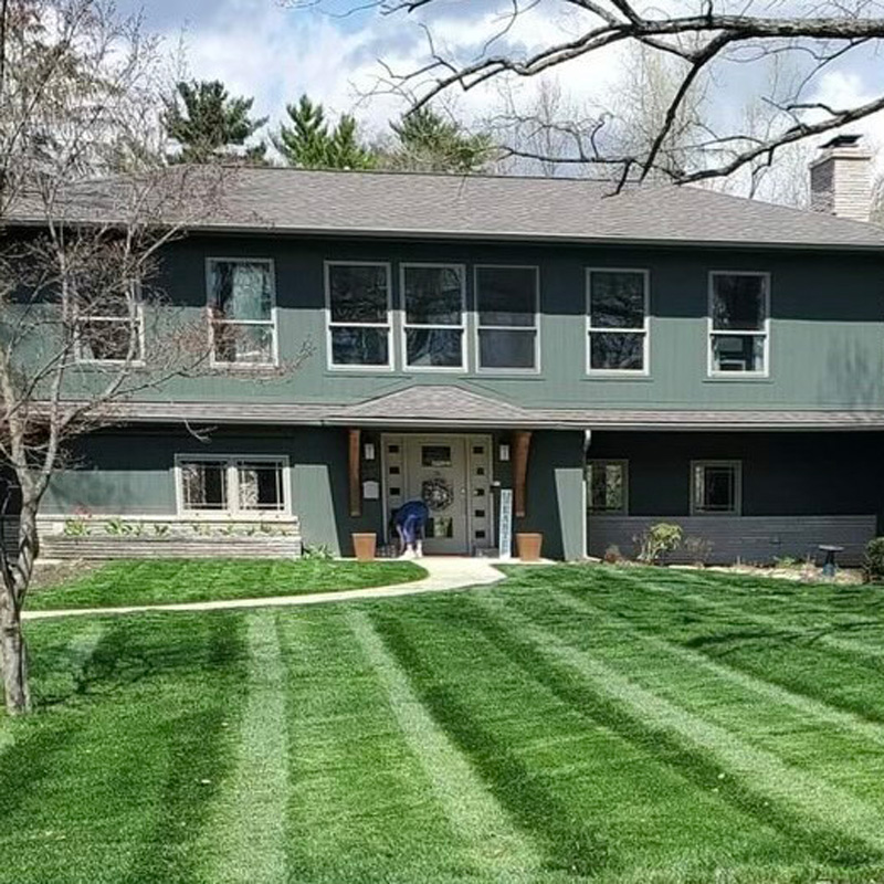 freshly cut lawn in front of a home